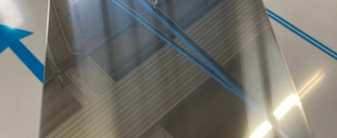 Impercold polished stainless steel sheet, with reflective surface for technical and design applications.